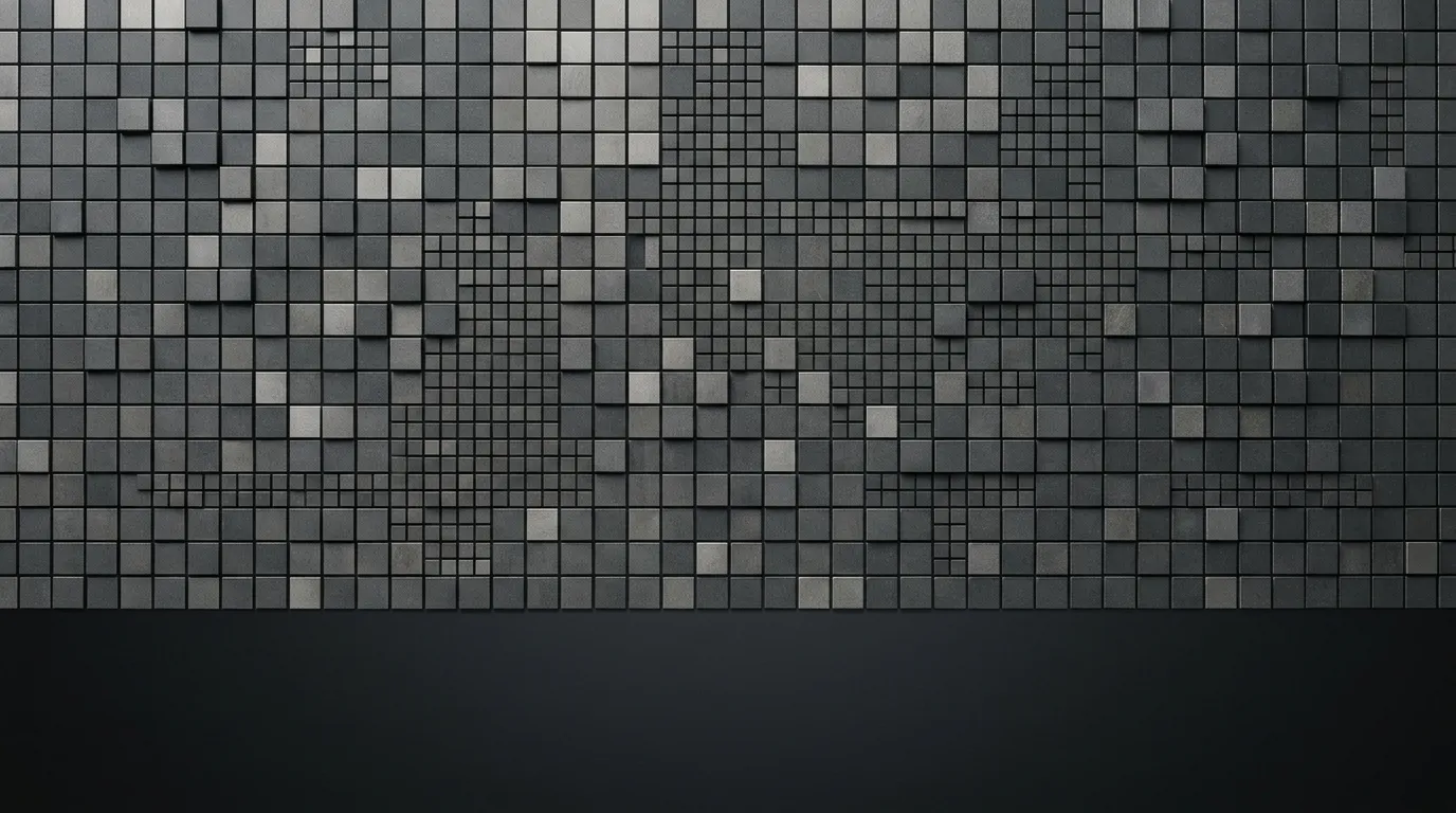 Abstraktní geometrický vzor čtvercových dlaždic v šedých tónech připomínající architekturu procesoru.